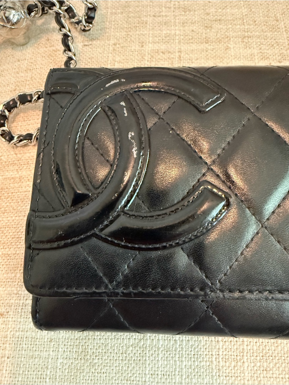 Chanel Black Quilted leather cambon flap wallet.